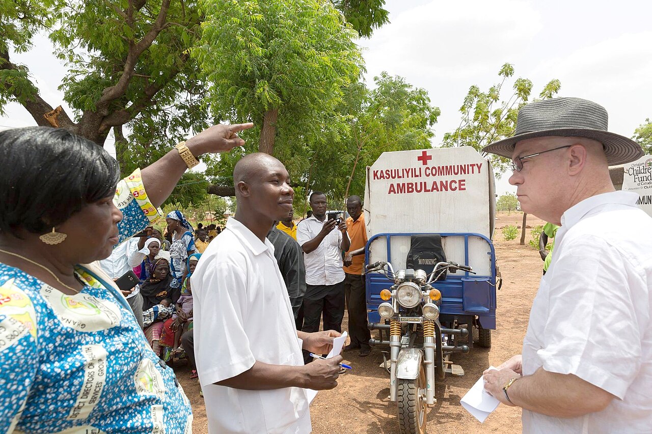 People talking during a community visit.